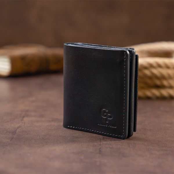 Вертикальное глянцевое портмоне с накладной монетницей GRANDE PELLE 11329 Черное 11329 фото