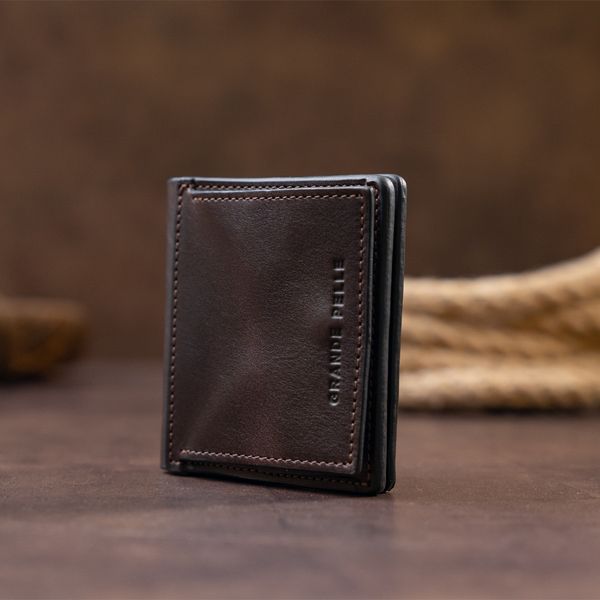 Вертикальне глянсове портмоне з накладною монетницьою GRANDE PELLE 11330 Шоколадне 11330 фото
